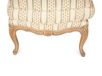 A Pair of Louis XV Style Carved Fruitwood Slipper Chairs