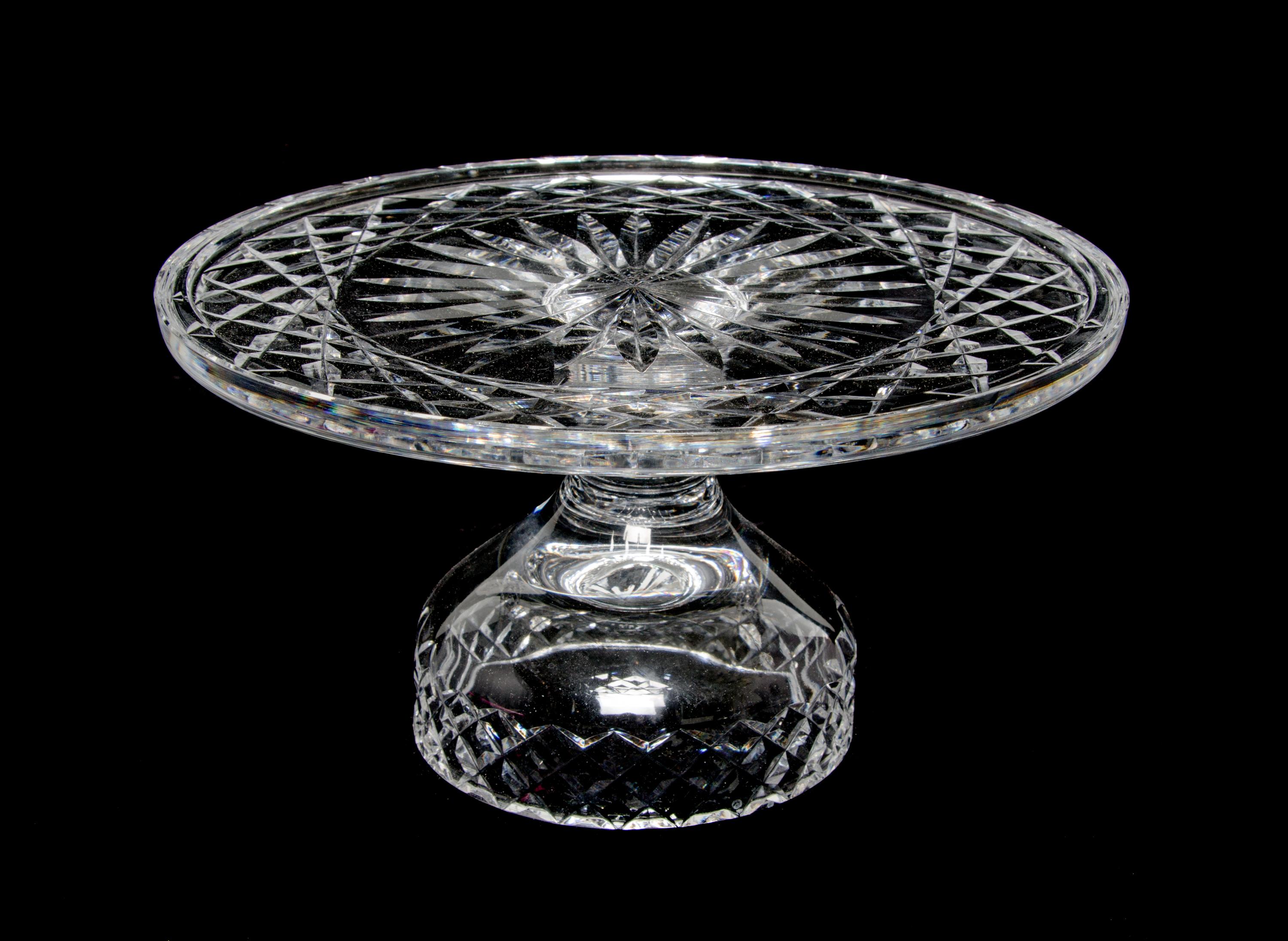 A Pressed Glass Cake Stand Height 5 1/4 x diameter 10 inches.