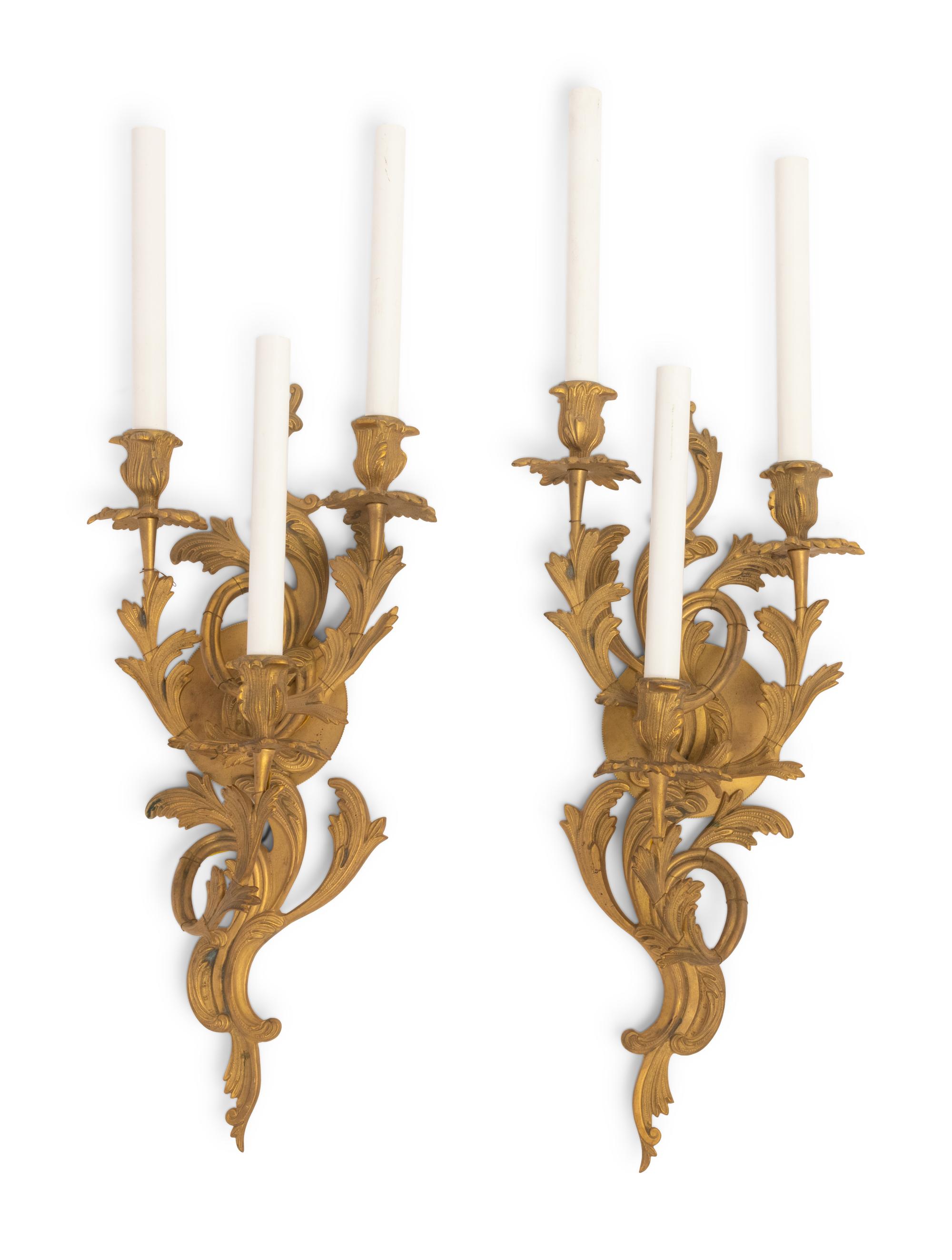 A Pair of Louis XV Style Gilt Bronze Three-Light Sconces