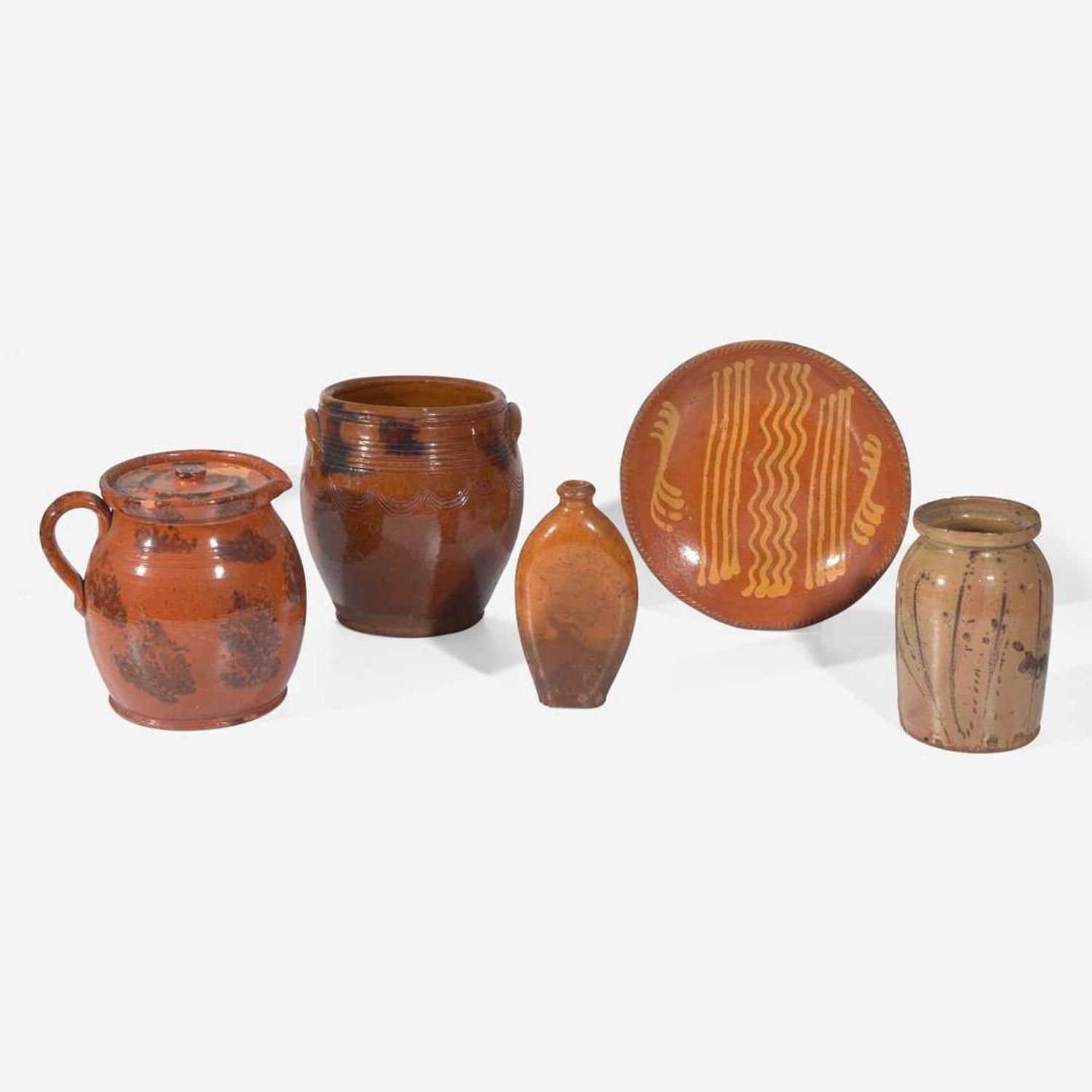 A group of five slip-decorated and incised redware tablewares 19th century