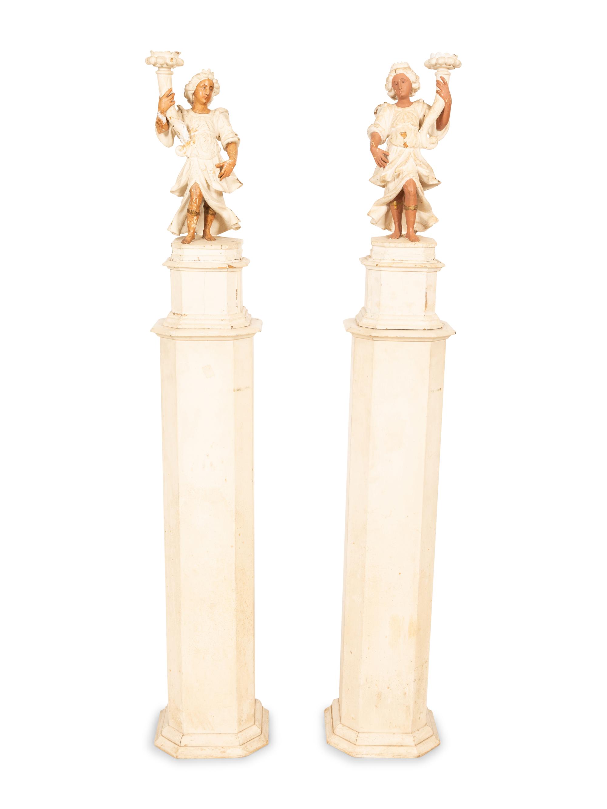A Pair of Italian Painted Figural Candelsticks on Pedestal Bases