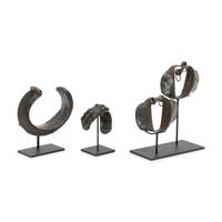 Four African Bronze Adornments on Fitted Stands