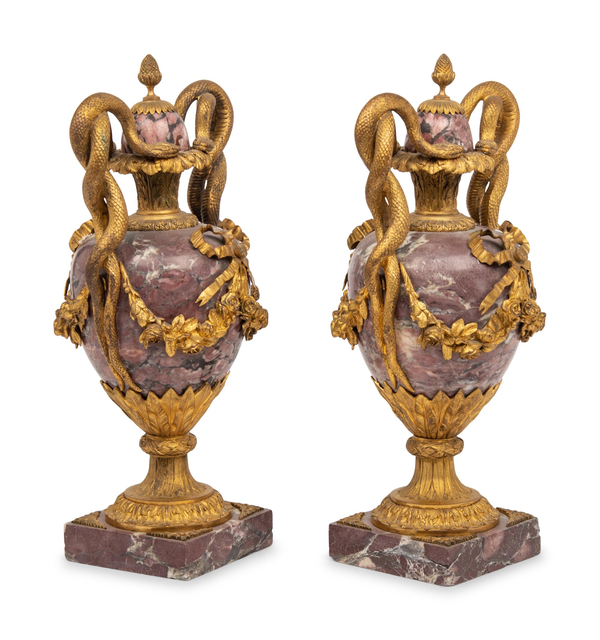 A Pair of French Gilt Bronze Mounted Breche Violette Urns