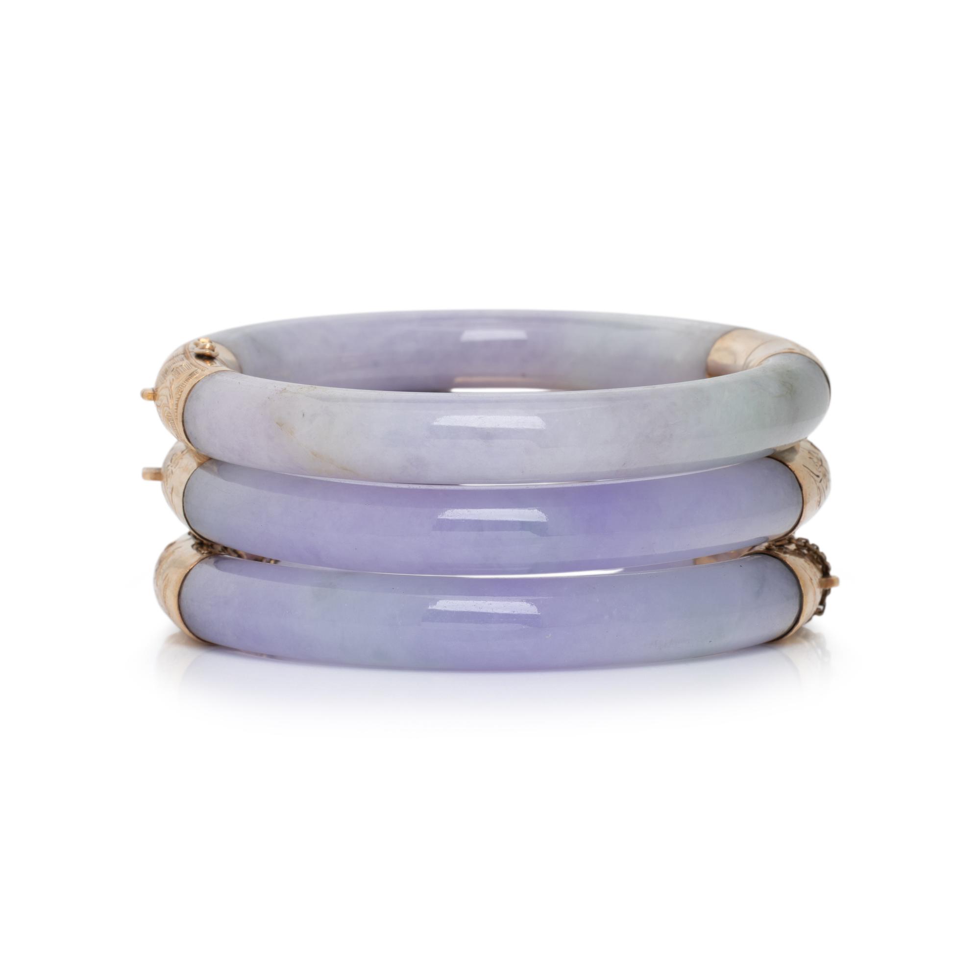 THREE JADE AND YELLOW GOLD BANGLE BRACELETS