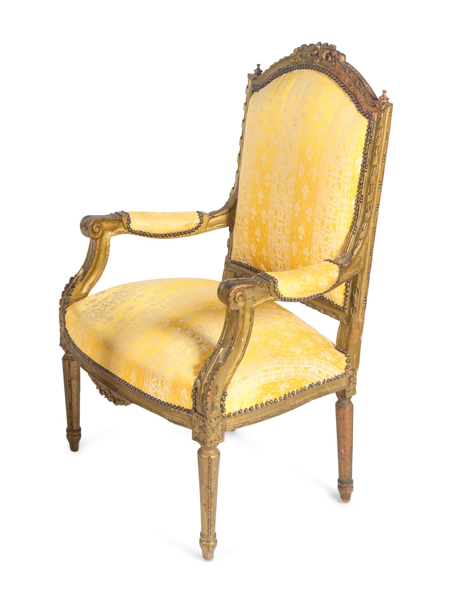 A Pair of Louis XVI Style Carved Giltwood Fauteuils — 20TH CENTURY