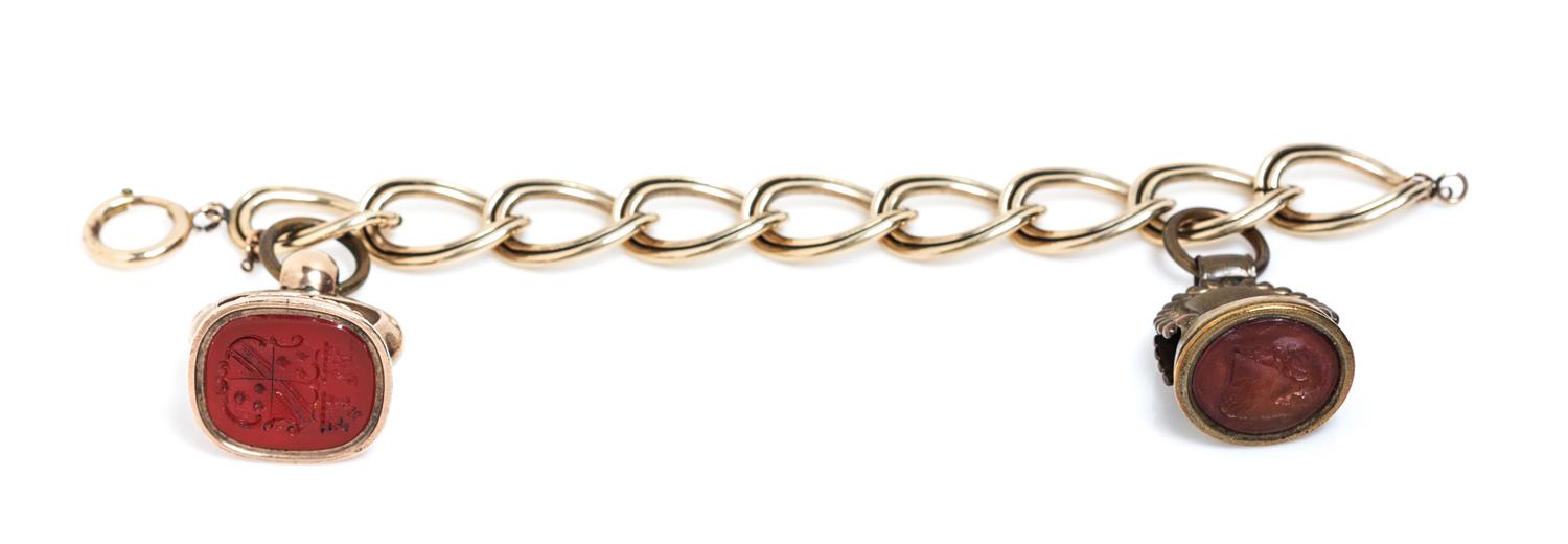 A Gold-Filled Bracelet with Two Attached Hardstone Intaglio Fobs, 51.30 dwts.