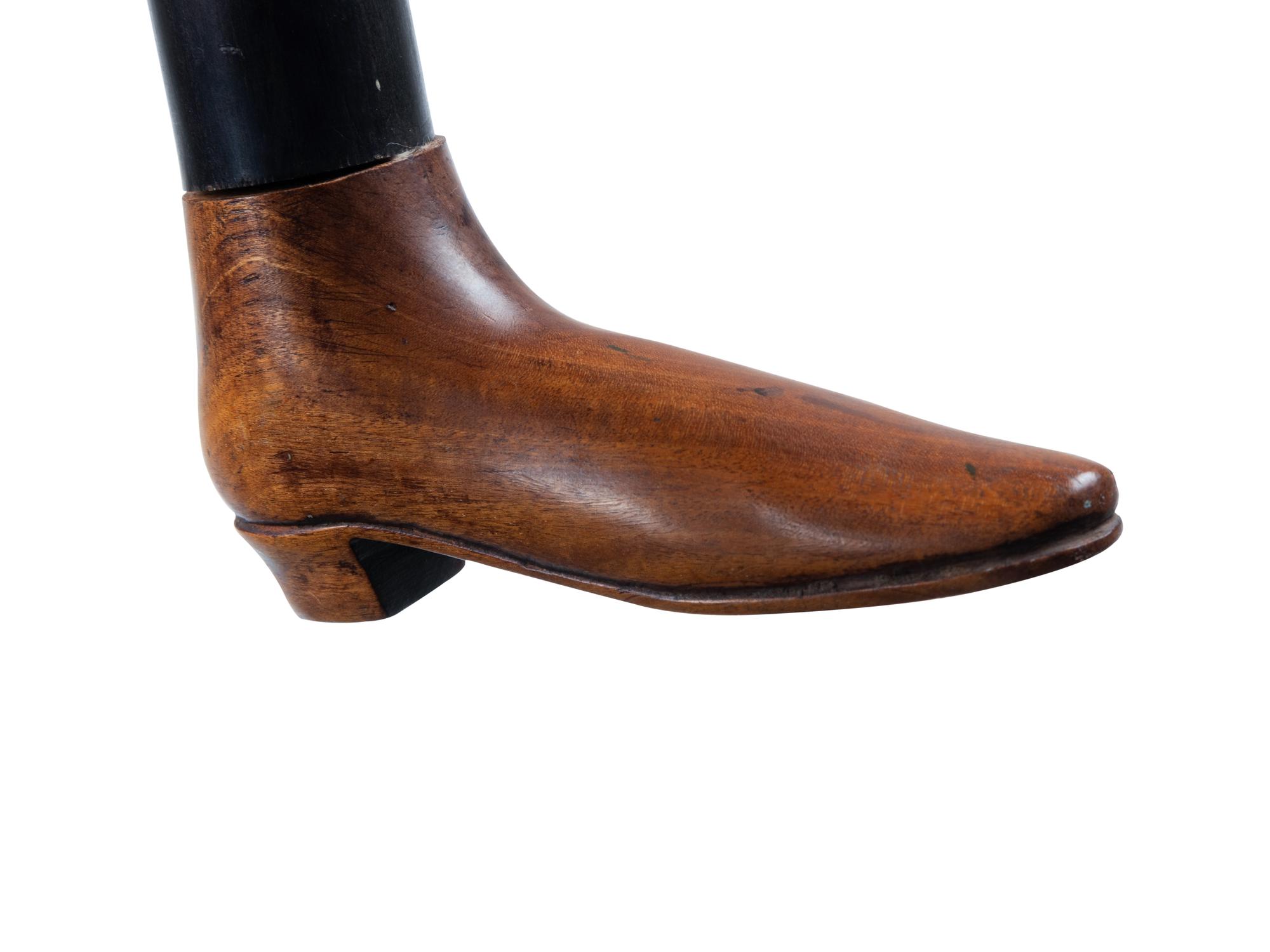 Two English Carved Wood Shoe-Form Canes