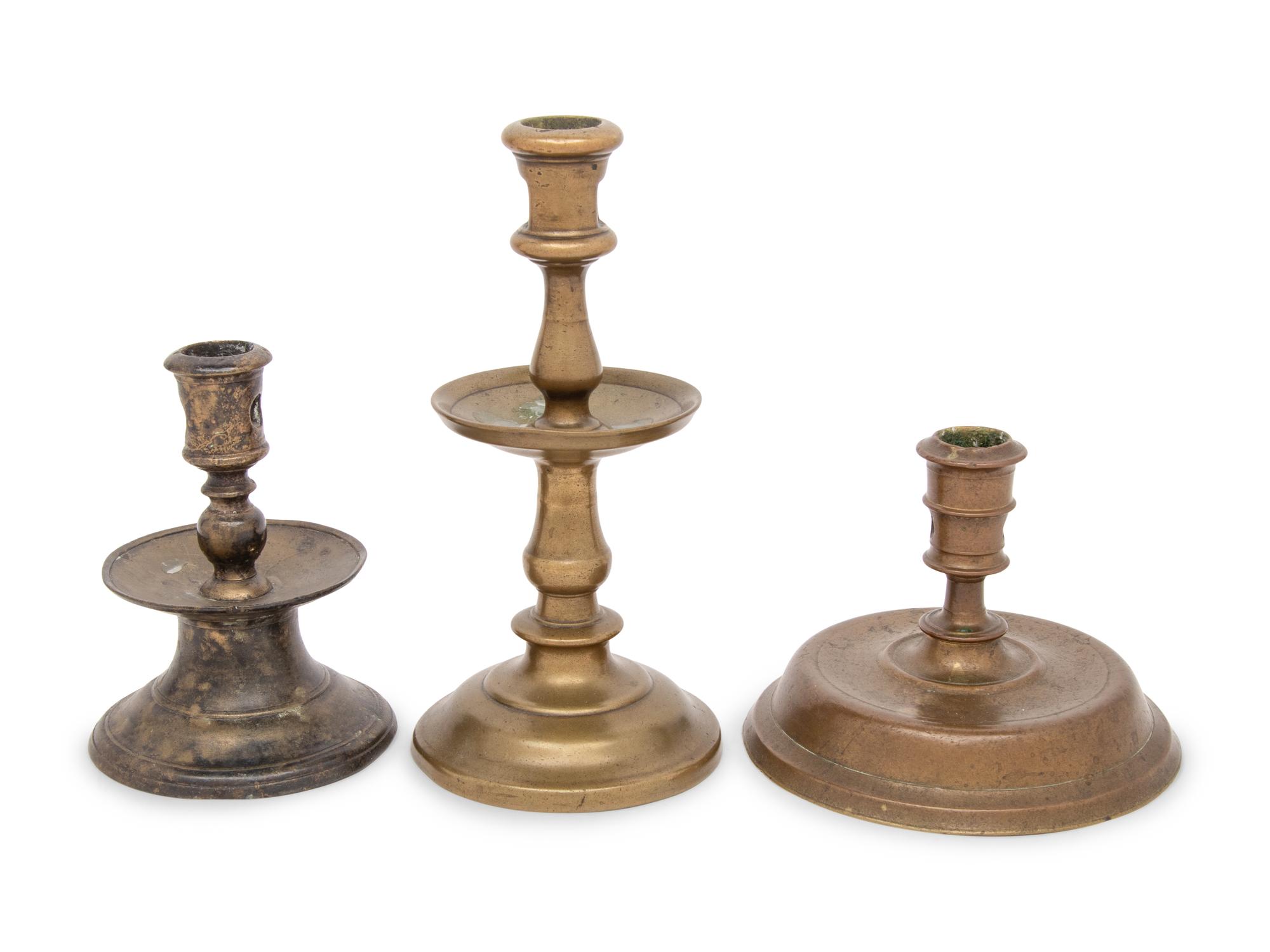 A Group of Three Dutch Brass Candlesticks