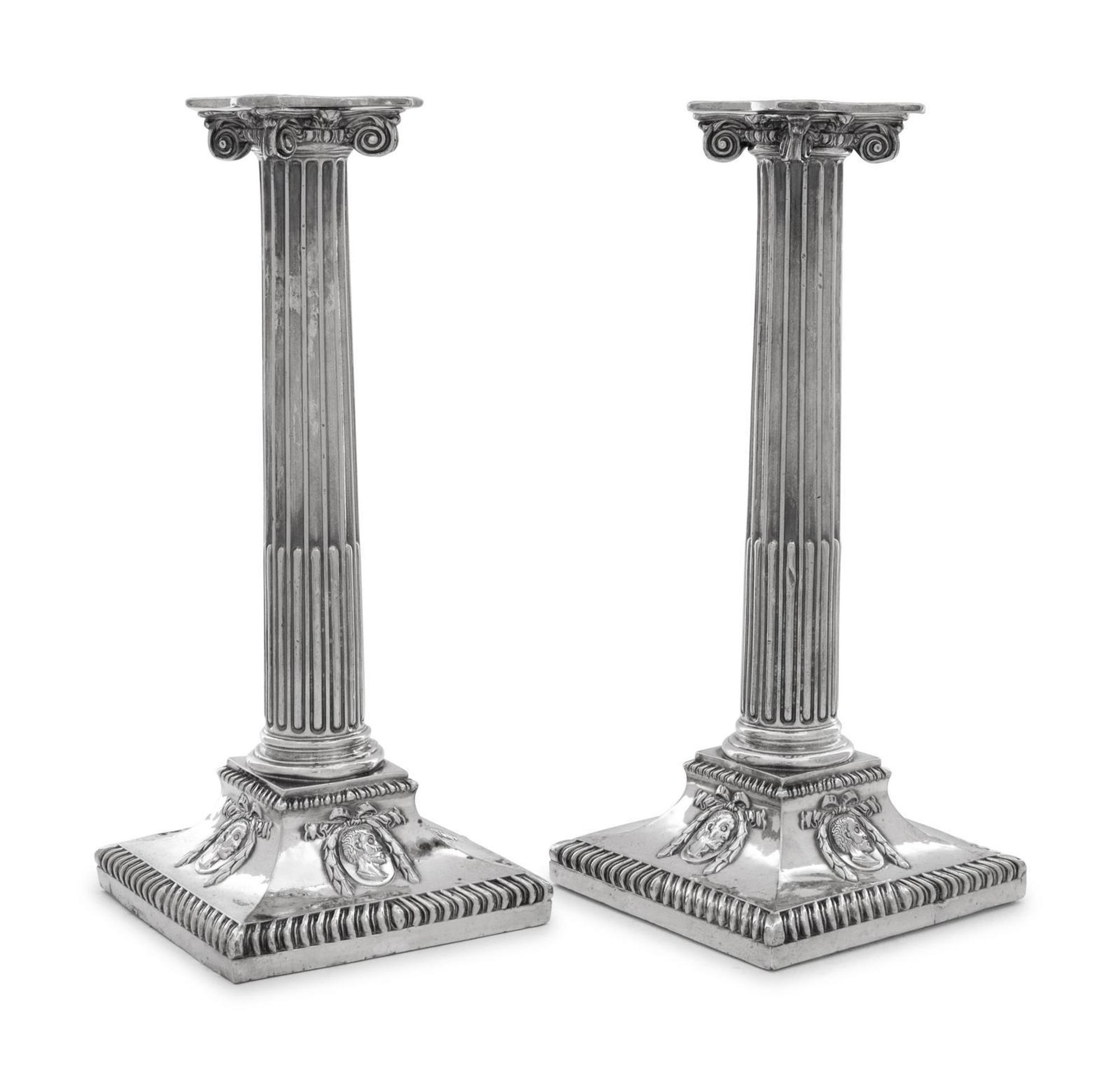 A Group of Four English Silver-Plate Candlesticks