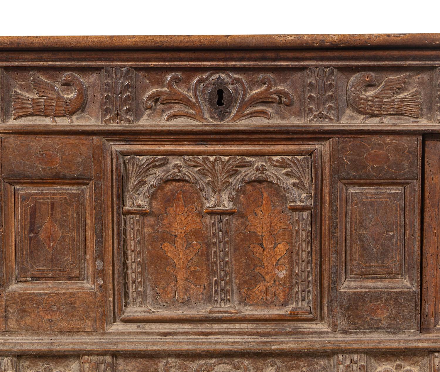 A Continental Carved and Inlaid Walnut Coffer