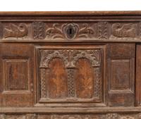 A Continental Carved and Inlaid Walnut Coffer