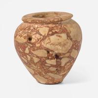 An Egyptian red breccia jar Predynastic Period (Naqada II), circa 3500-2900 B.C.