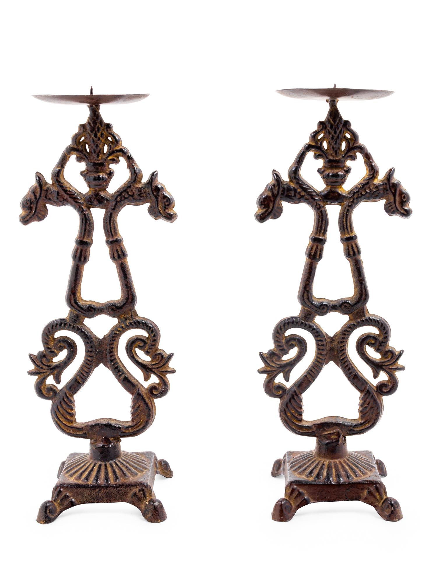 A Pair of Chinese Cast Iron Candle Stands
