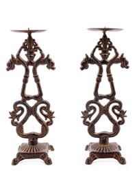 A Pair of Chinese Cast Iron Candle Stands