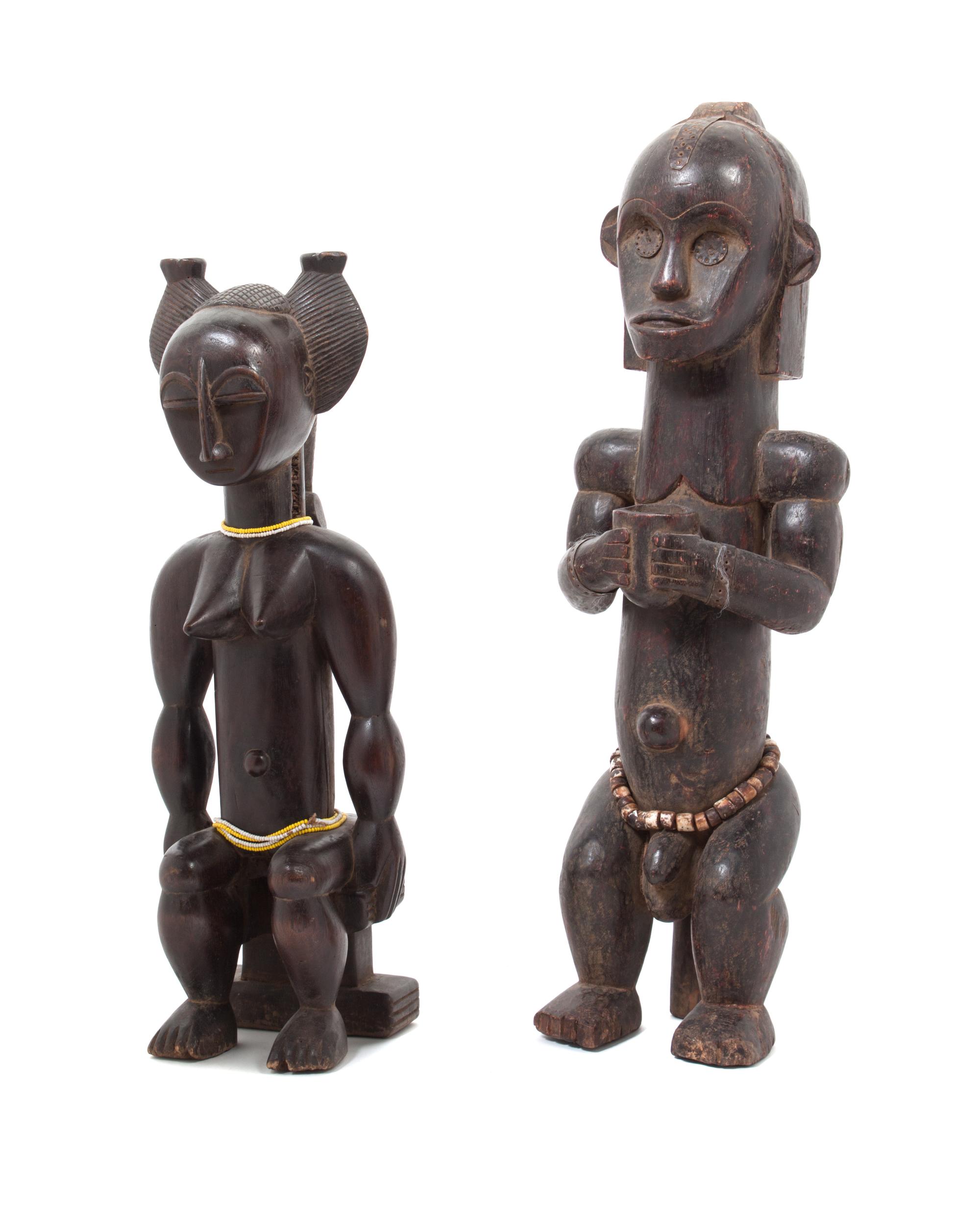 Two Carved Wood African Figures Height of tallest 22 inches.