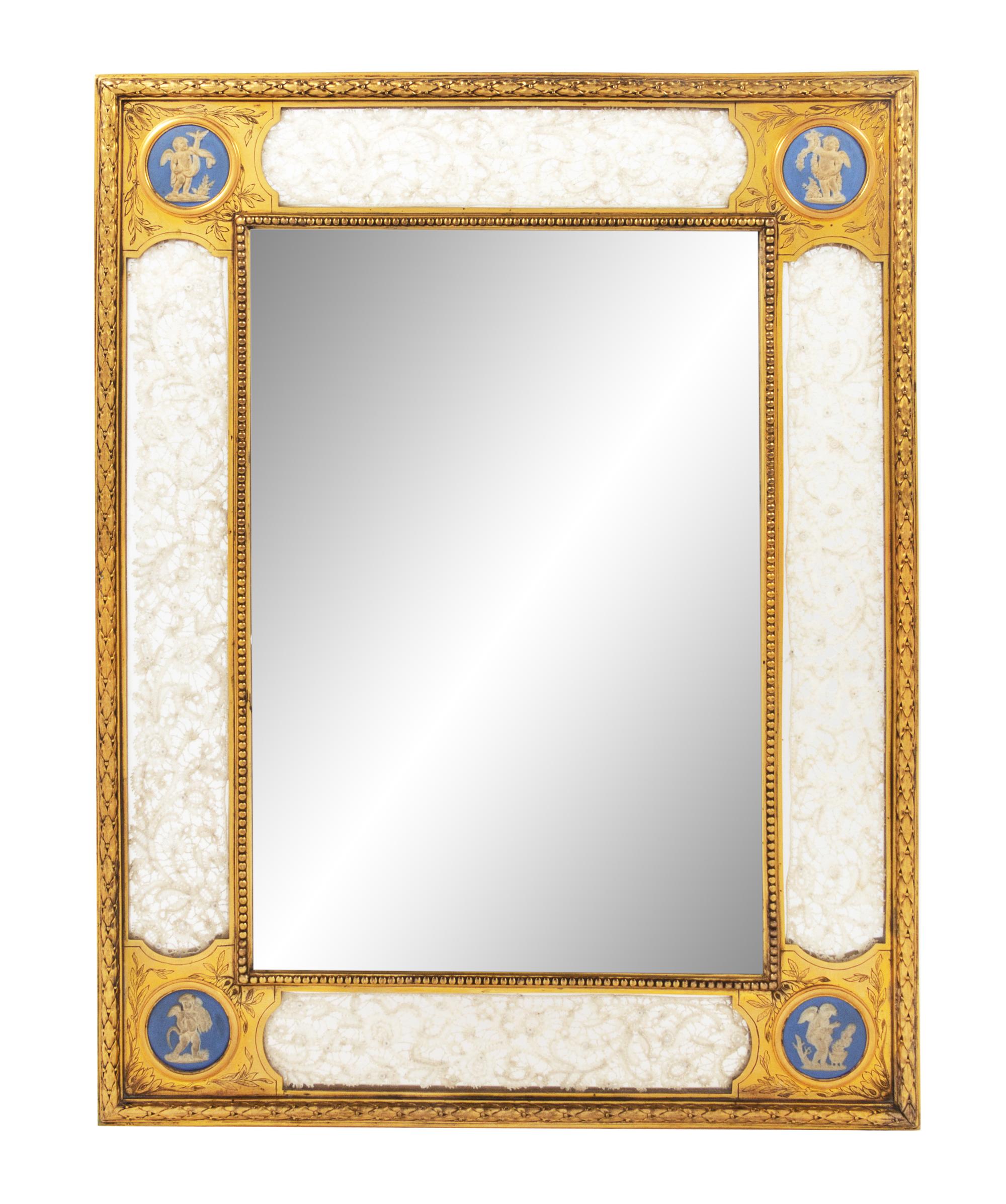 A Continental Gilt Bronze and Bisque Porcelain Picture Frame