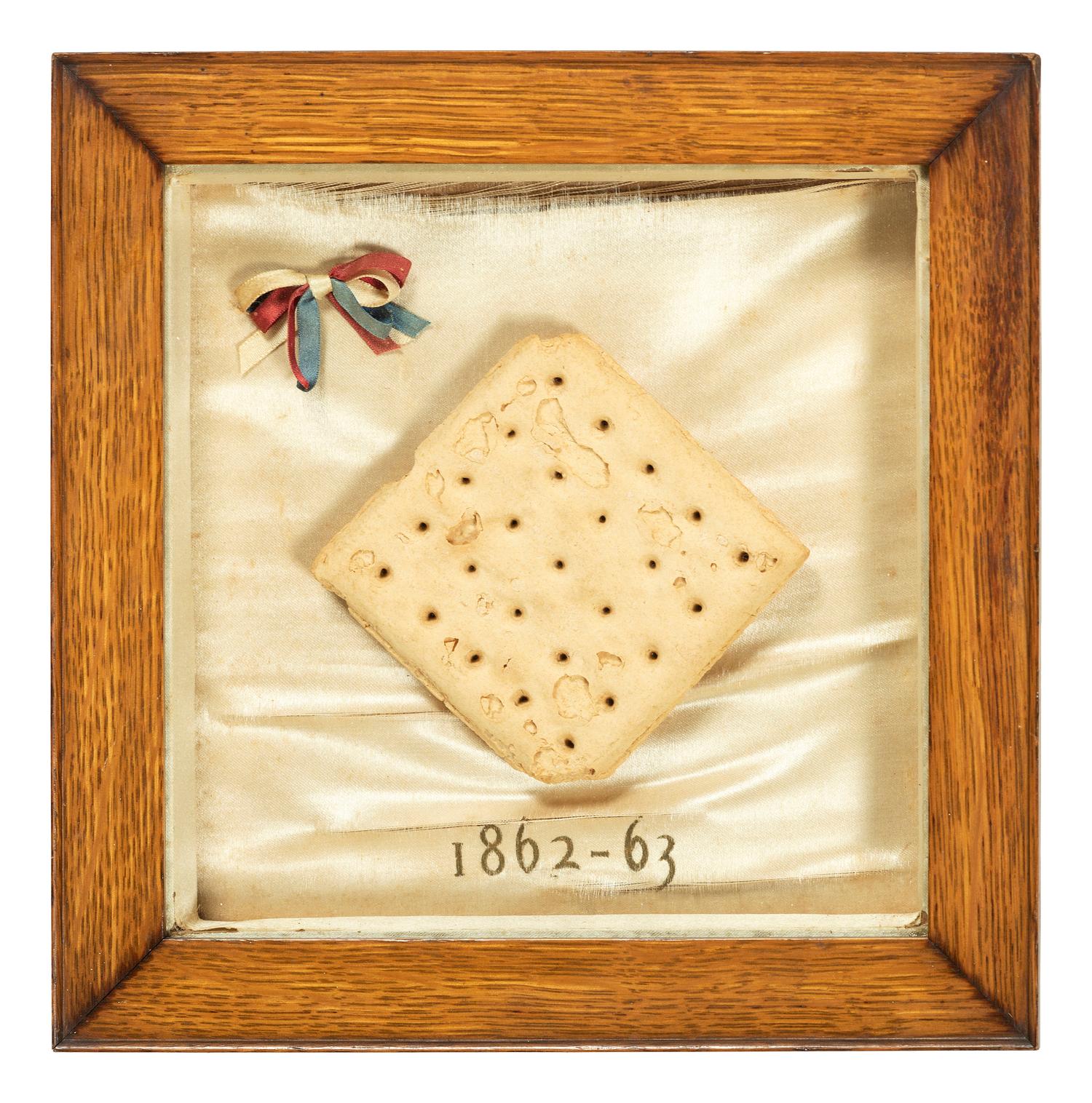 [CIVIL WAR]. Framed hardtack with tri-color ribbon, dated 1862-1863.