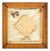 [CIVIL WAR]. Framed hardtack with tri-color ribbon, dated 1862-1863.