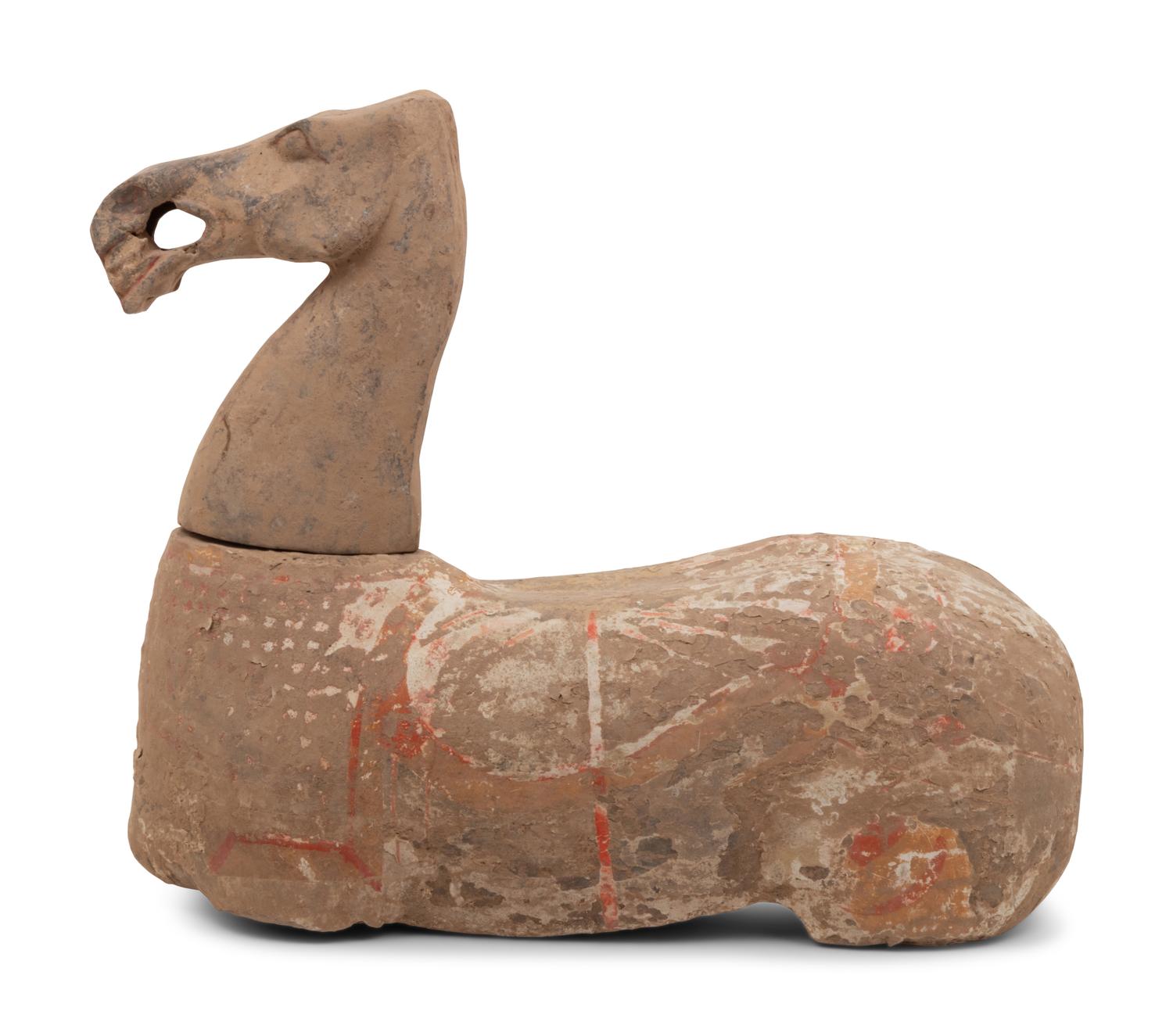 A Chinese Pottery Figure of a Recumbent Horse