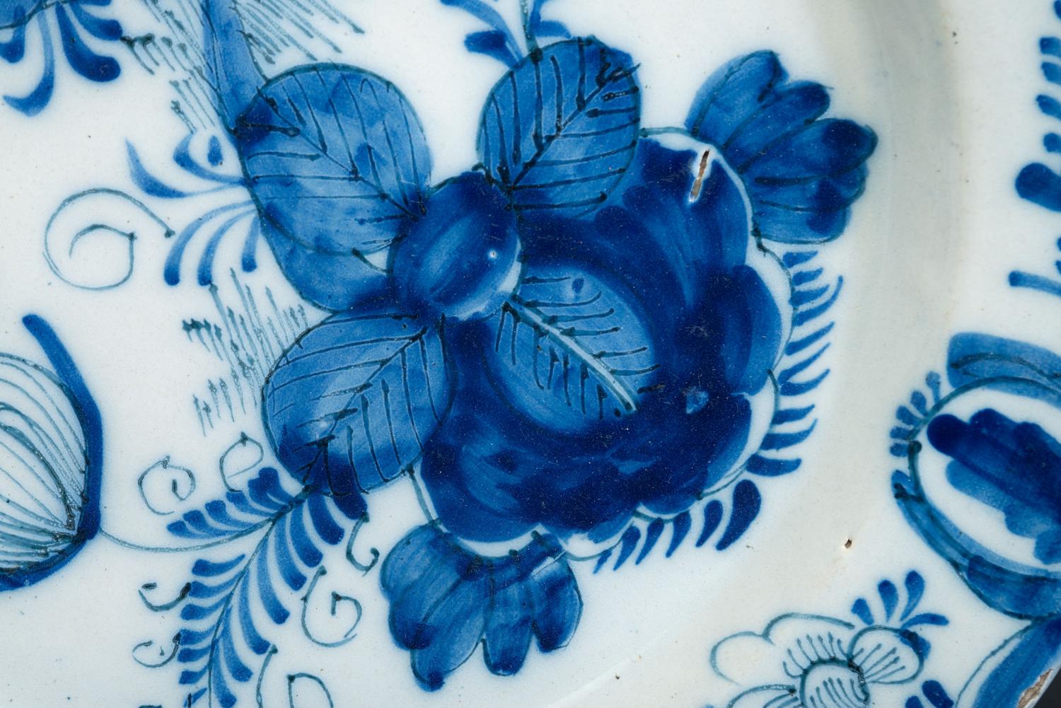 A Floral Decorated Delftware Charger