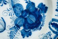 A Floral Decorated Delftware Charger