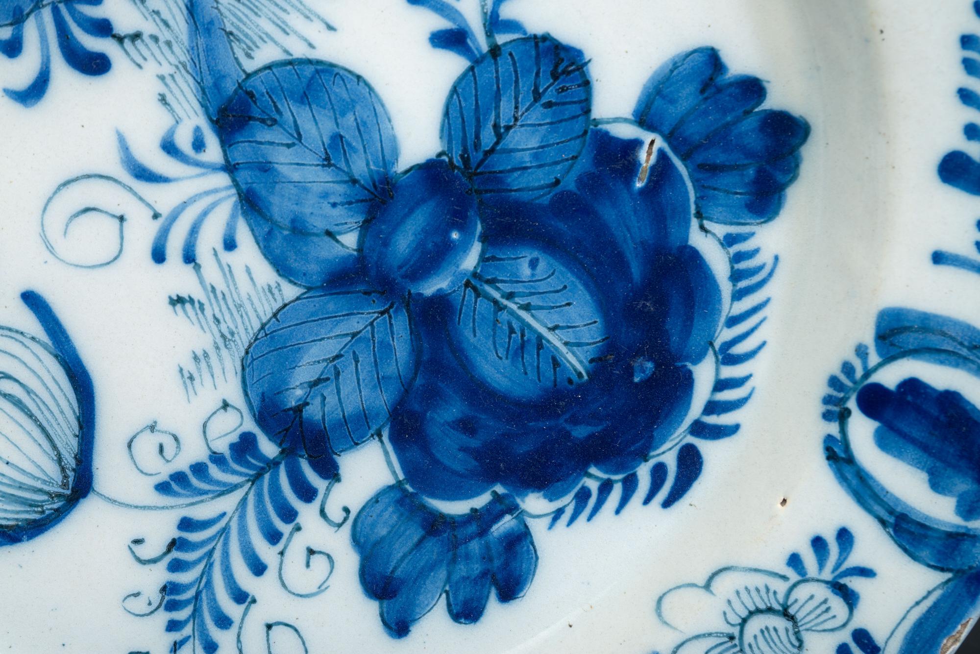 A Floral Decorated Delftware Charger