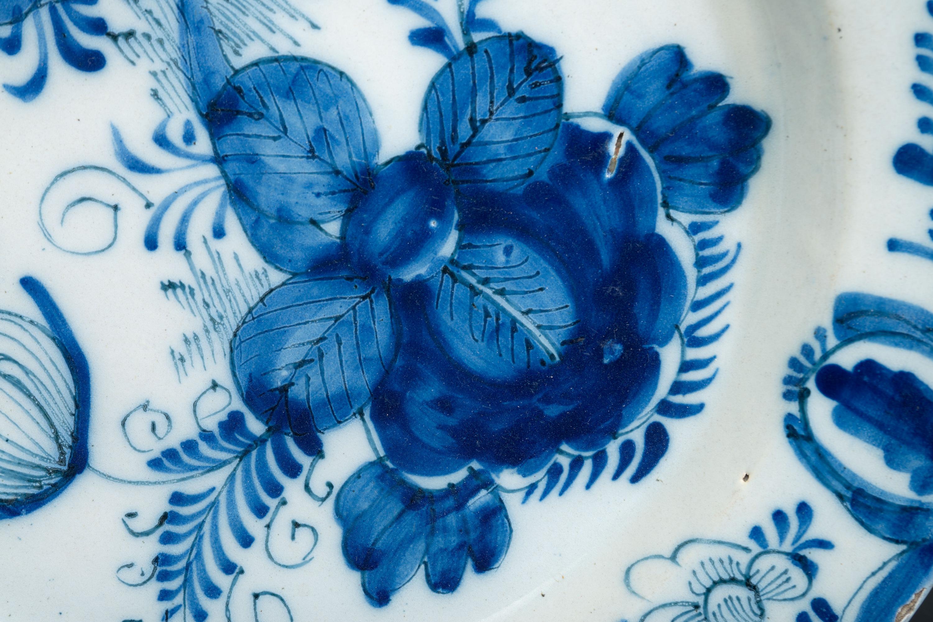 A Floral Decorated Delftware Charger