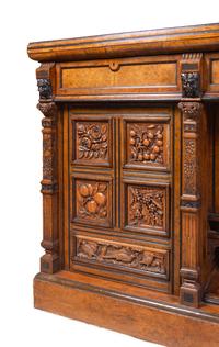 A Continental Carved Walnut and Burlwood Serving Cabinet