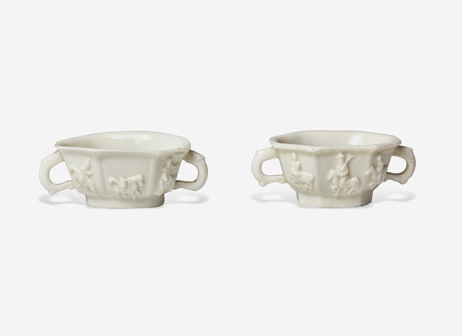 Two Similar Chinese Dehua Porcelain Twin Handled Cups