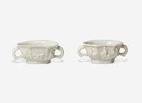 Two Similar Chinese Dehua Porcelain Twin Handled Cups