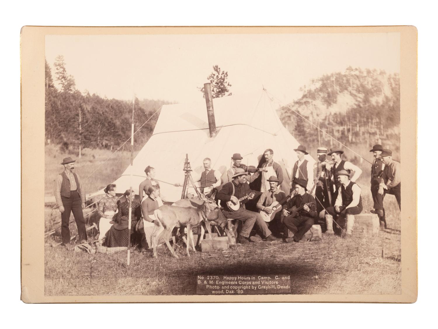 [WESTERN AMERICANA]. GRABILL, John C.H. (1849-1903), photographer. Happy Hours in Camp. G. and B. & M. Engineers Corps and Visitors. Deadwood, South Dakota, 1889.