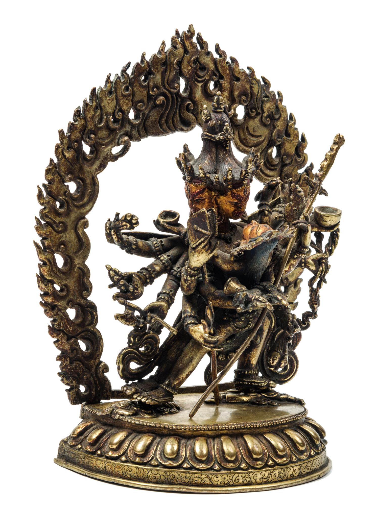 A Sino-Tibetan Gilt Bronze Figure of a Multi-Head Deity