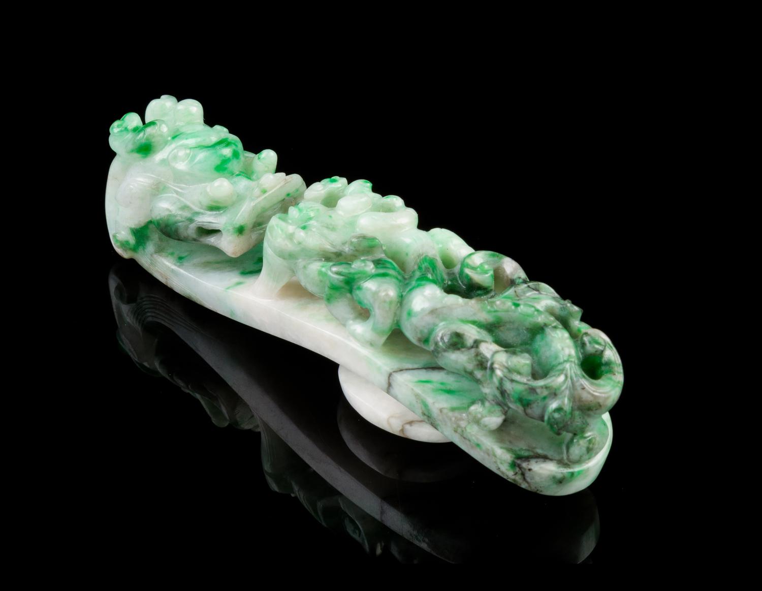 A Chinese Jadeite Dragon Belt Hook 19TH CENTURY, LATE QING DYNASTY Length 3 inches. — 19TH CENTURY, LATE QING DYNASTY