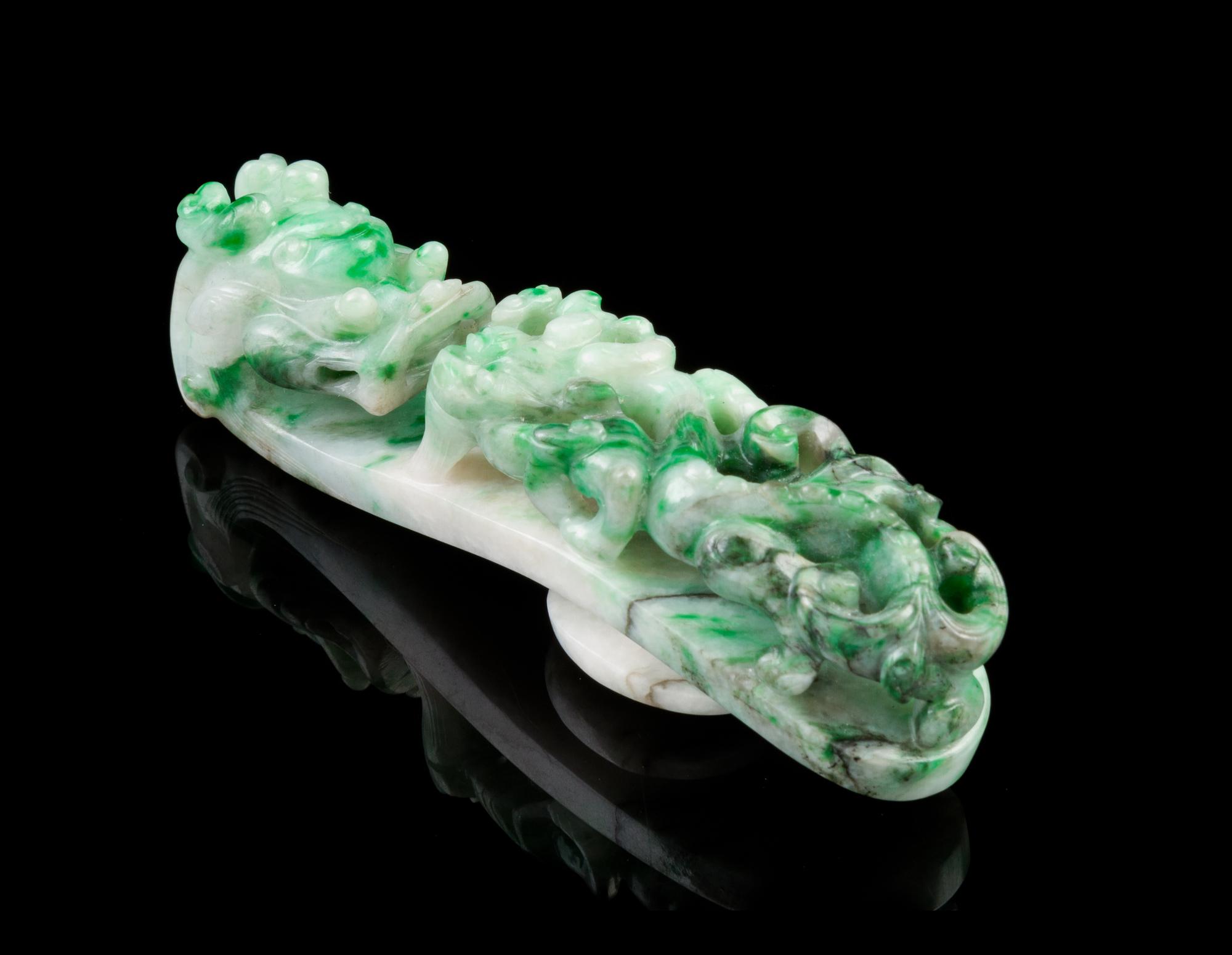 A Chinese Jadeite Dragon Belt Hook 19TH CENTURY, LATE QING DYNASTY Length 3 inches. — 19TH CENTURY, LATE QING DYNASTY