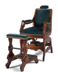 An Archer Velvet Upholstered Goose Neck Walnut Barber Chair and Footstool
