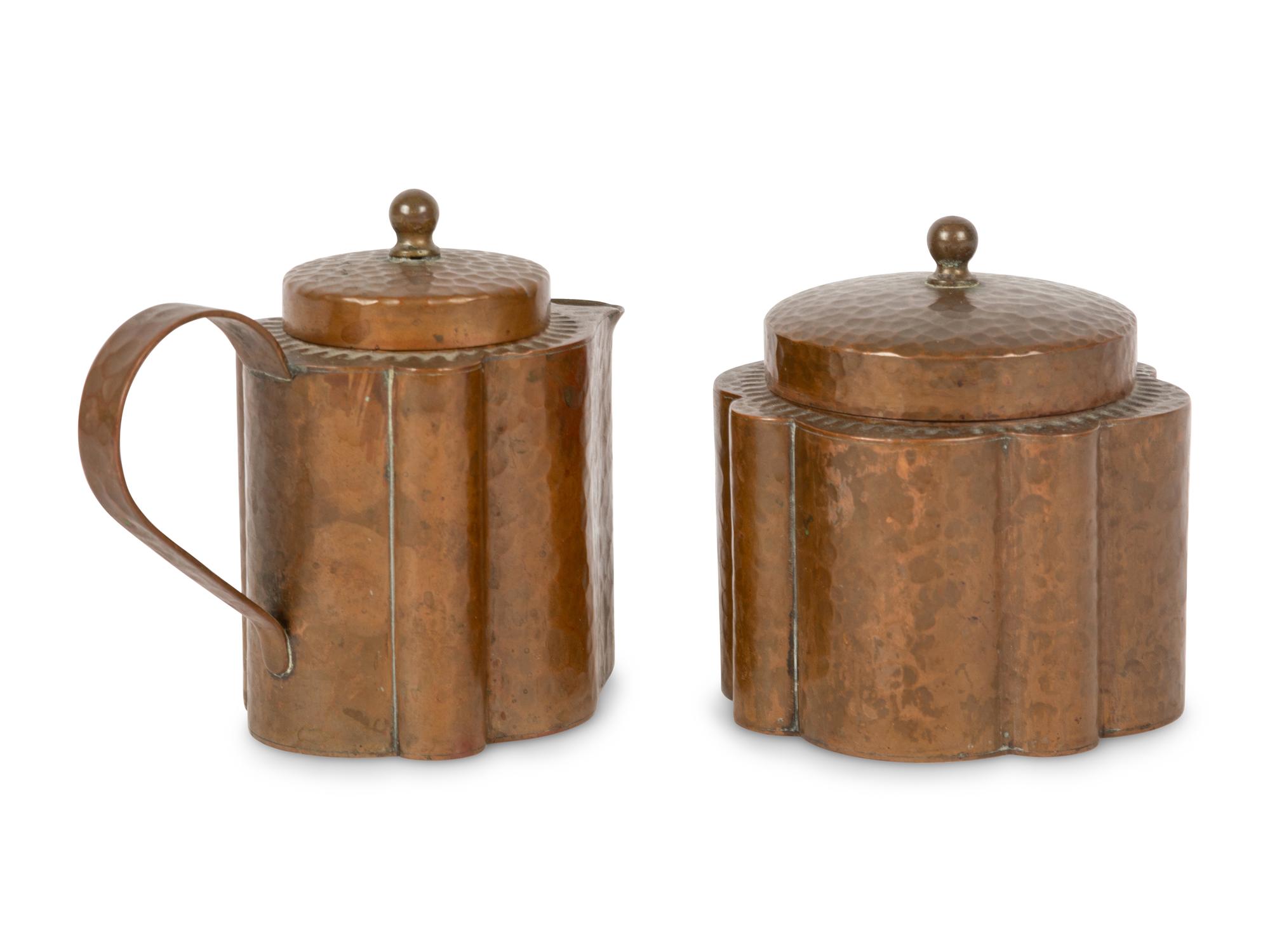 A Joseph Heinrichs Hammered Copper on Silver Creamer and Sugar