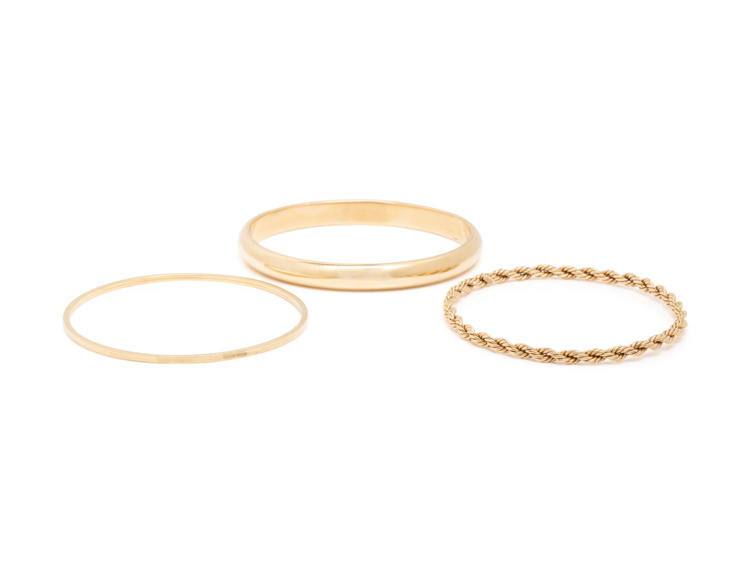 COLLECTION OF YELLOW GOLD BANGLE BRACELETS