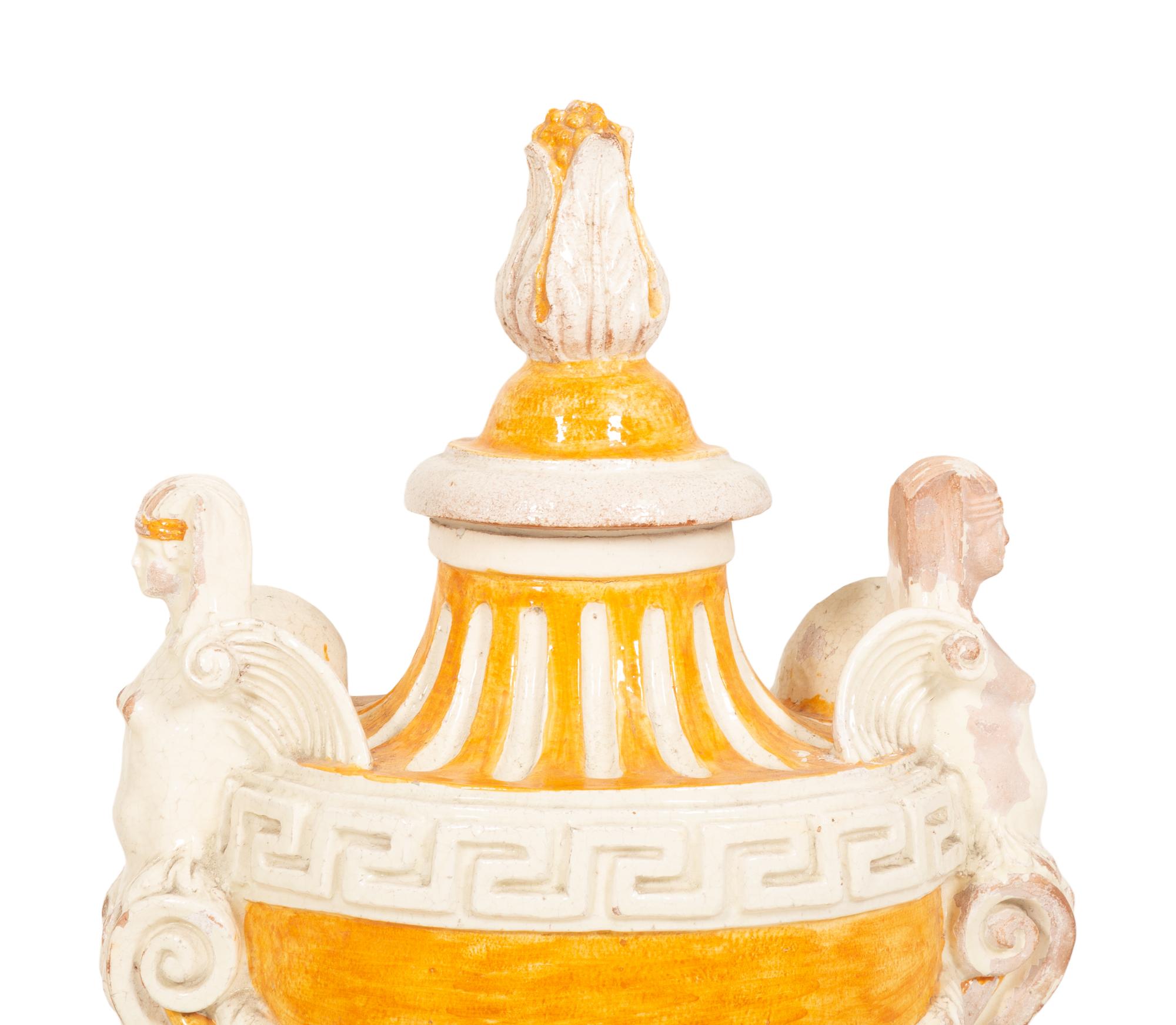 A Pair of Italian Glazed Terracotta Covered Urns