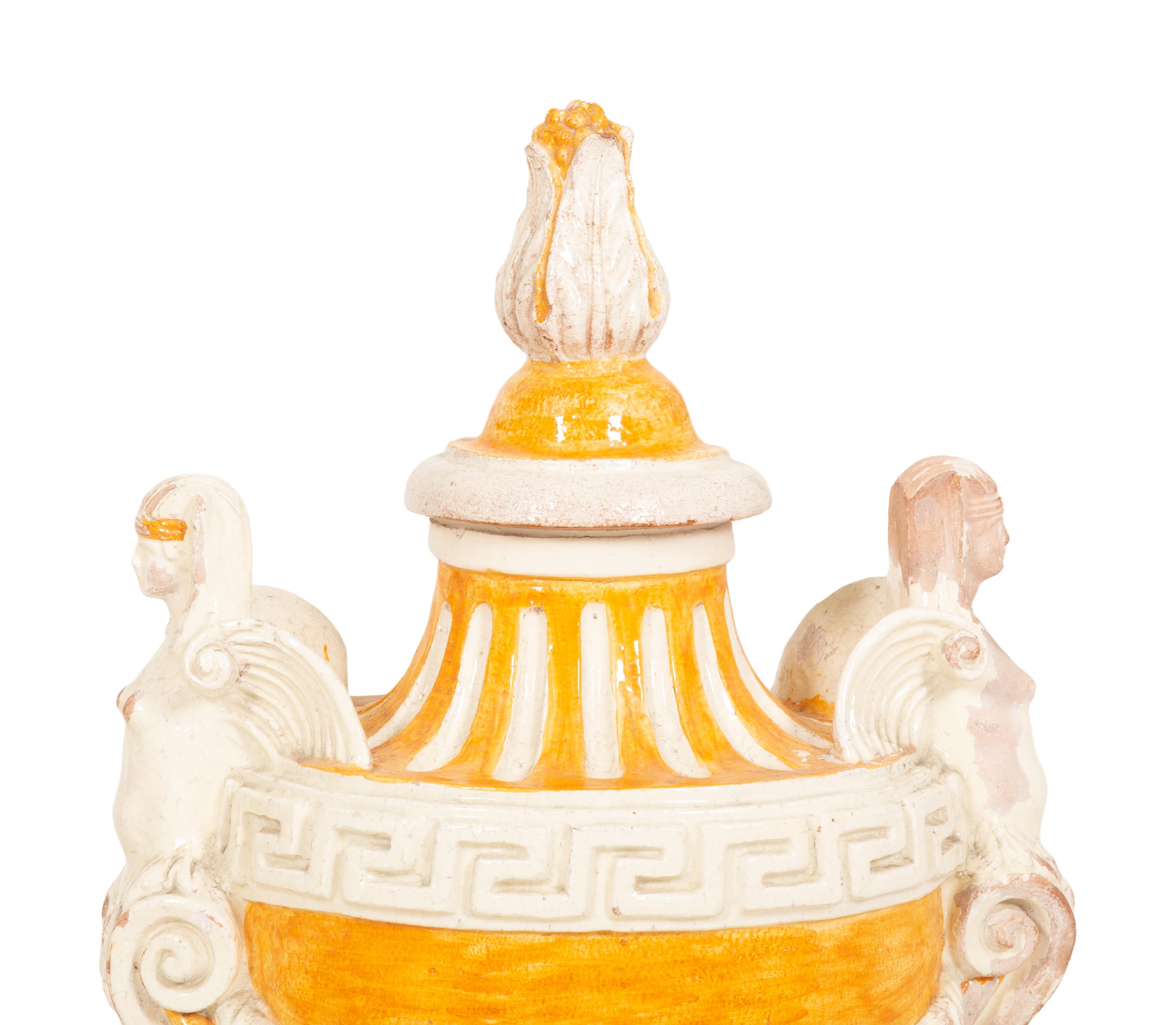 A Pair of Italian Glazed Terracotta Covered Urns