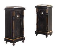 A Pair of English Aesthetic Jasperware Medallion-Mounted Ebonized and Parcel-Gilt Pedestal Cabinets