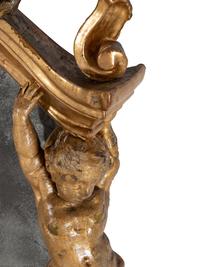 An Italian Rococo Figural Carved Giltwood Mirror