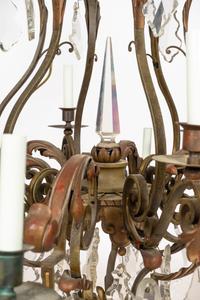 A French Wrought Iron, Tole and Cut Glass Twelve-Light Chandelier