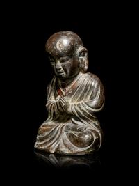 A Small Bronze Figure of a Seated Monk