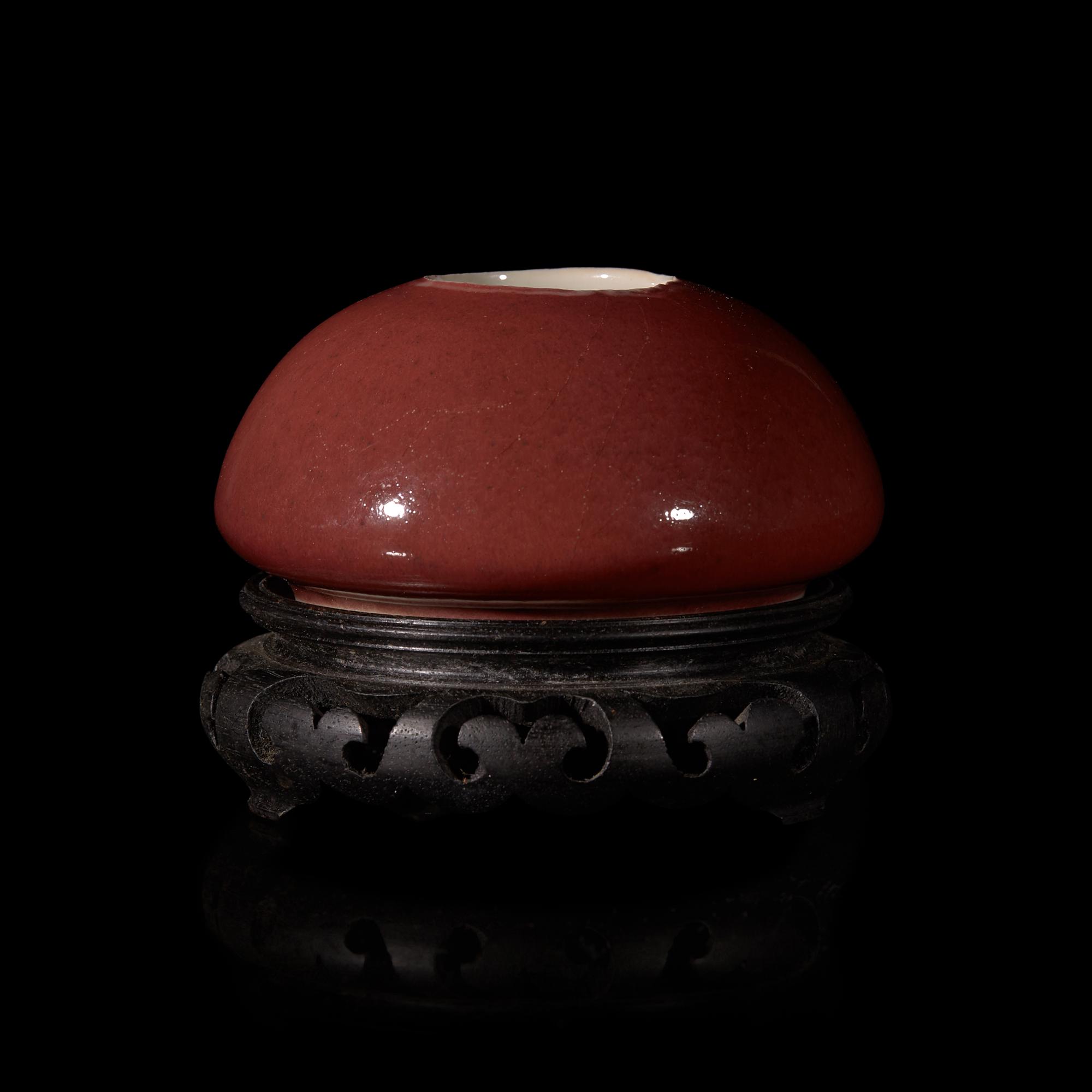 A Chinese Copper Red Glazed Water Coupe, 19th Century 清中晚期 霽紅釉雞心水丞