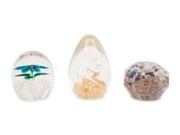 A Group of Three Glass Paperweights