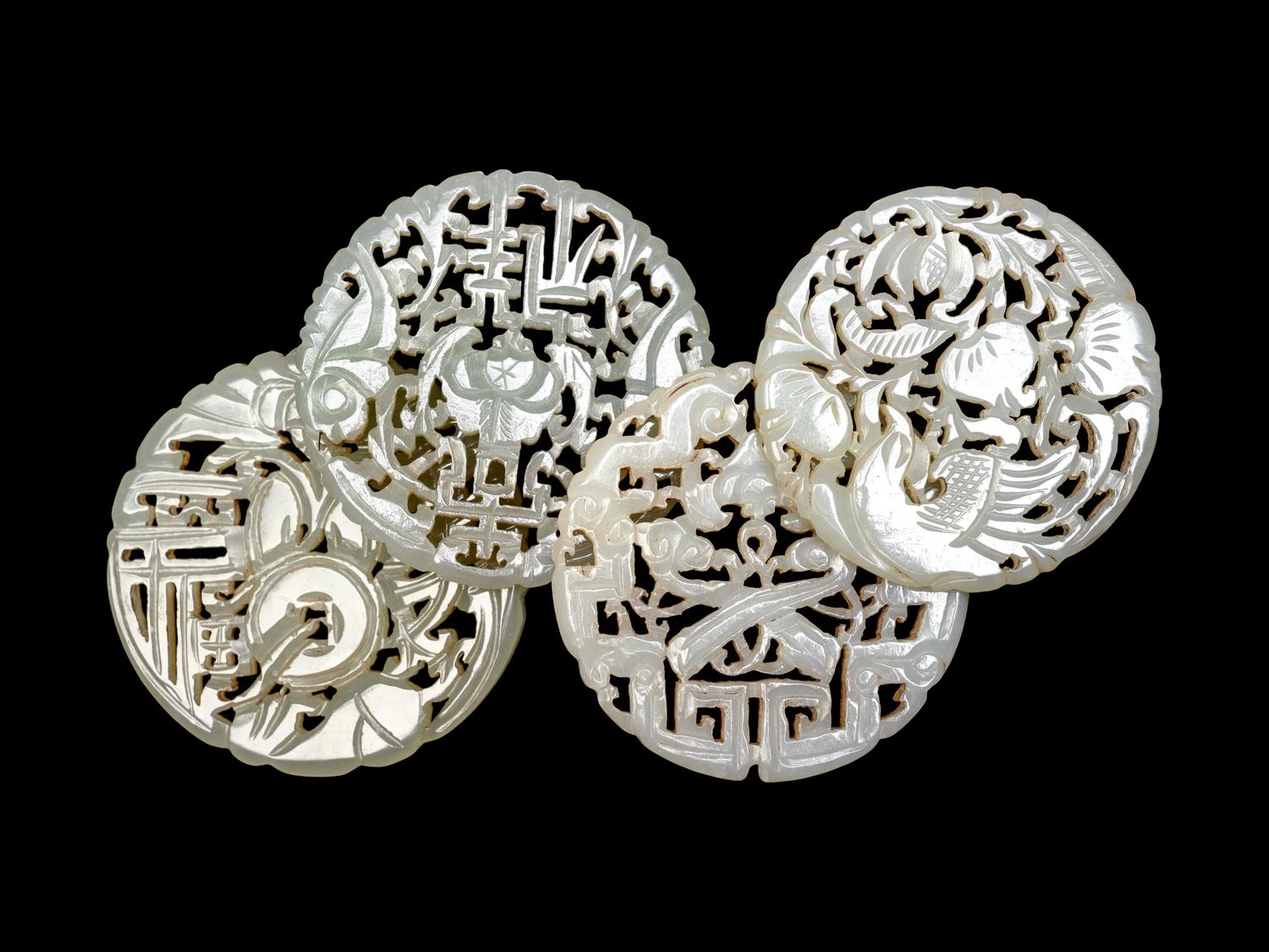 Four Chinese Celadon Jade Reticulated Plaques