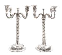A Pair of German Silver Four-Light Candelabra, Early 20th Century, each central stem issuing four S-scroll candle arms worked to show t