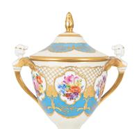 A Fürstenberg Porcelain Gilded Two-Handled Figural Urn