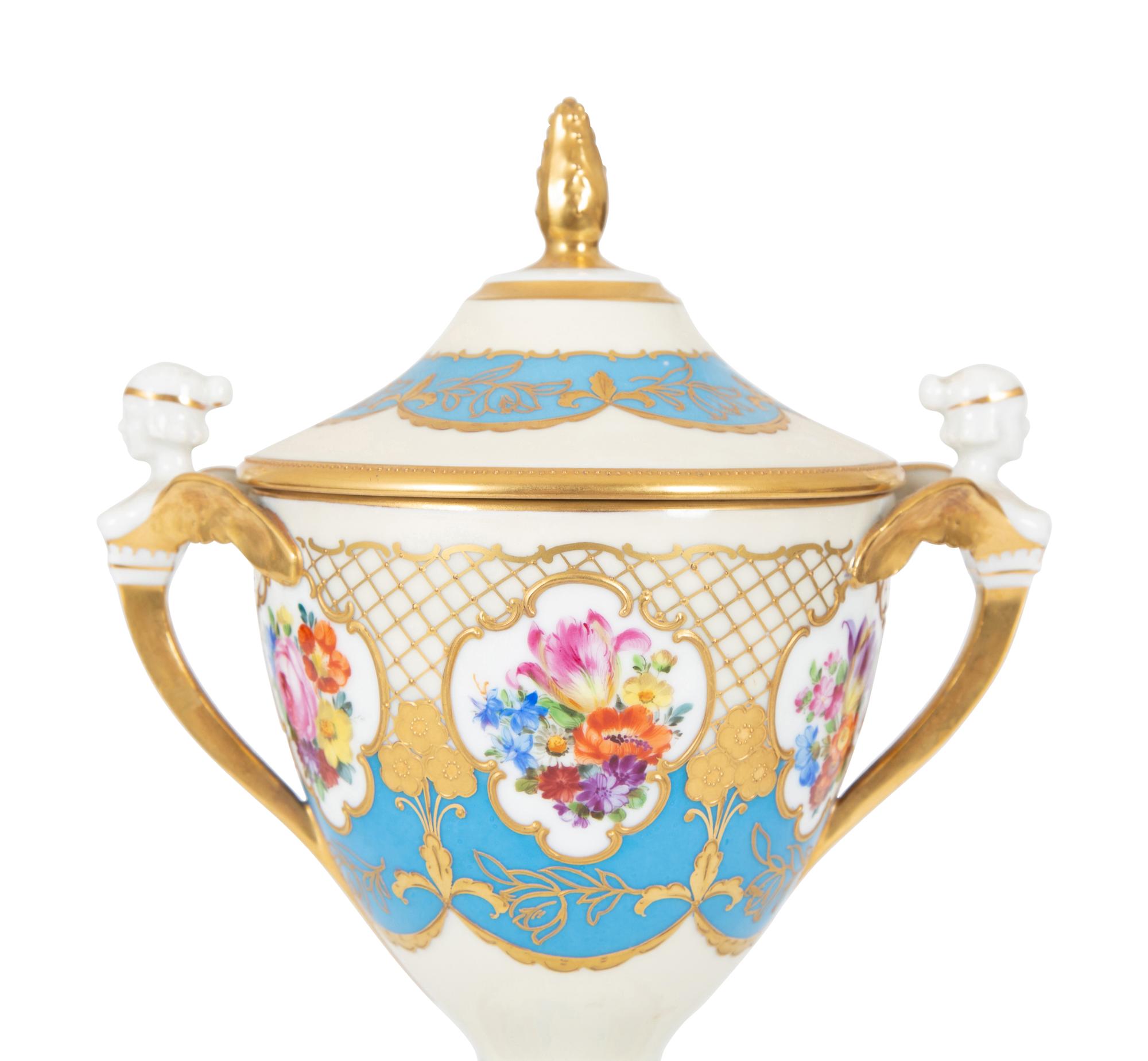 A Fürstenberg Porcelain Gilded Two-Handled Figural Urn