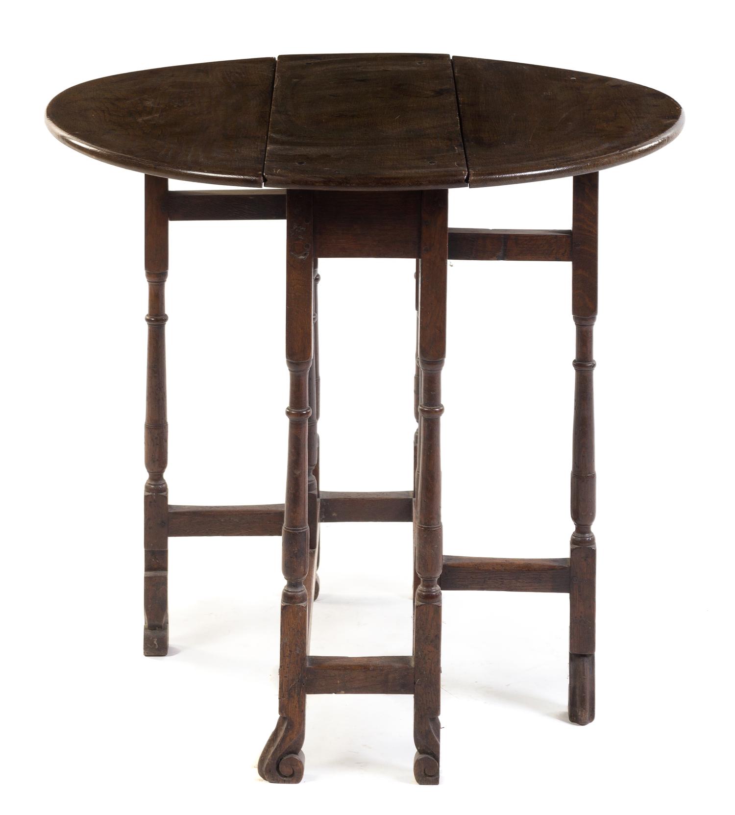 An English Oak Gate-Leg Table Height 28 1/4 x width 10 1/4 x depth 27 inches. — EARLY 20TH CENTURY